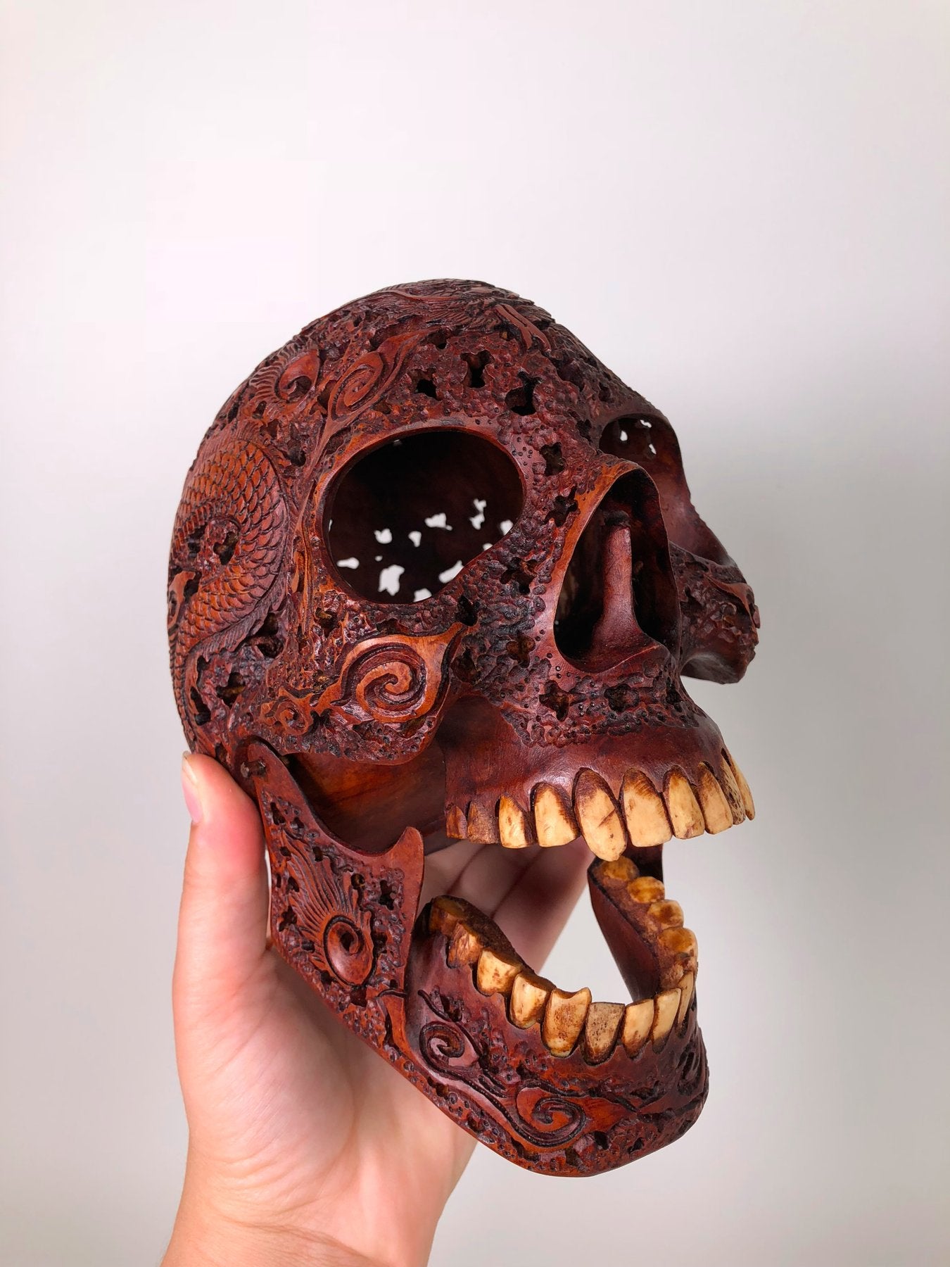 Human skull made of rosewood, carved and engraved