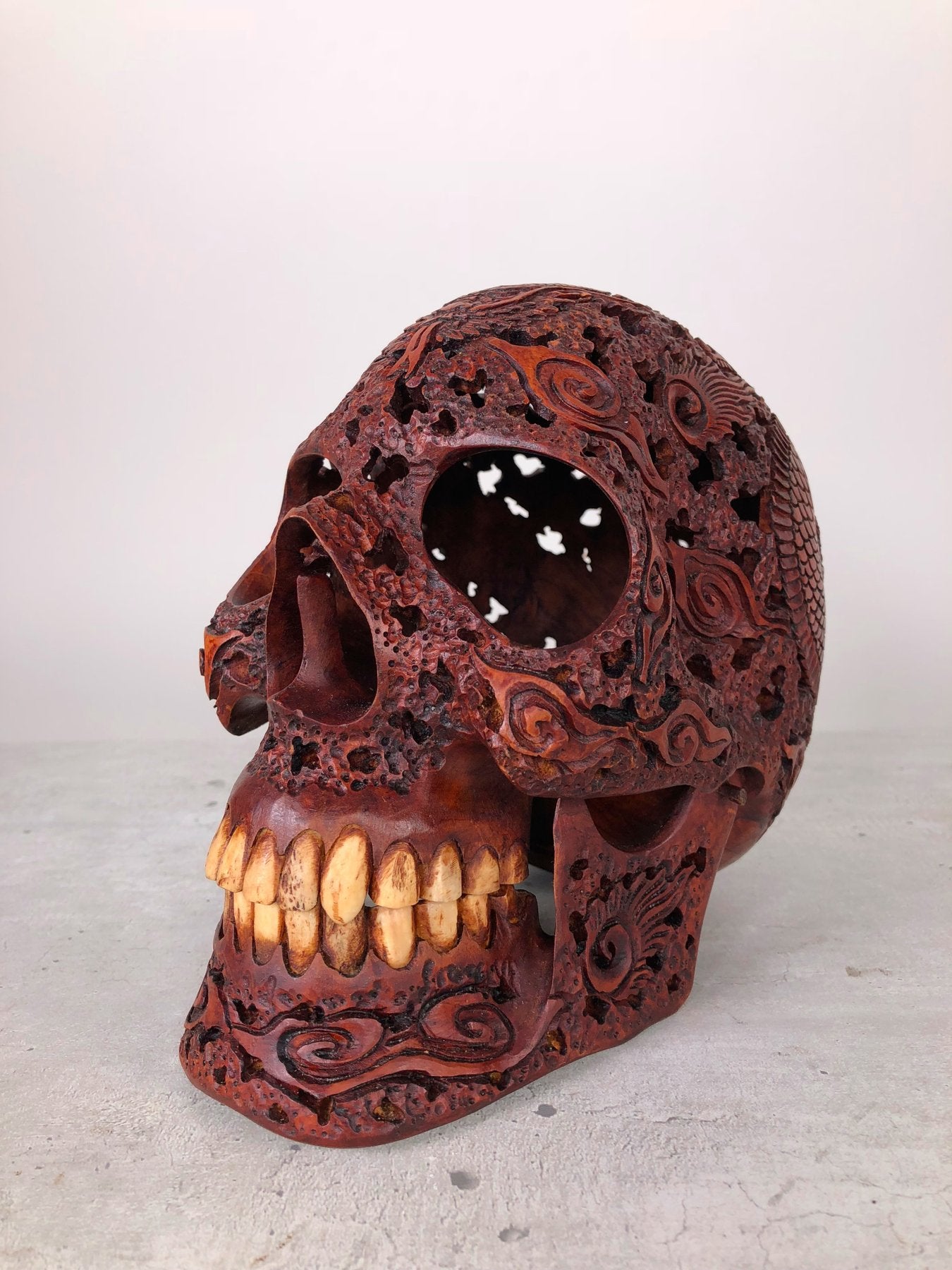Human skull made of rosewood, carved and engraved
