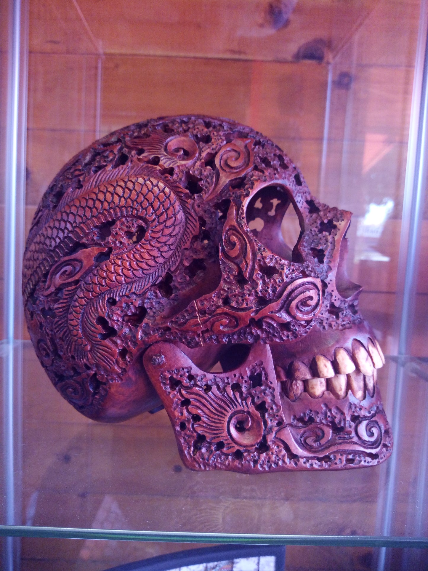 Human skull made of rosewood, carved and engraved