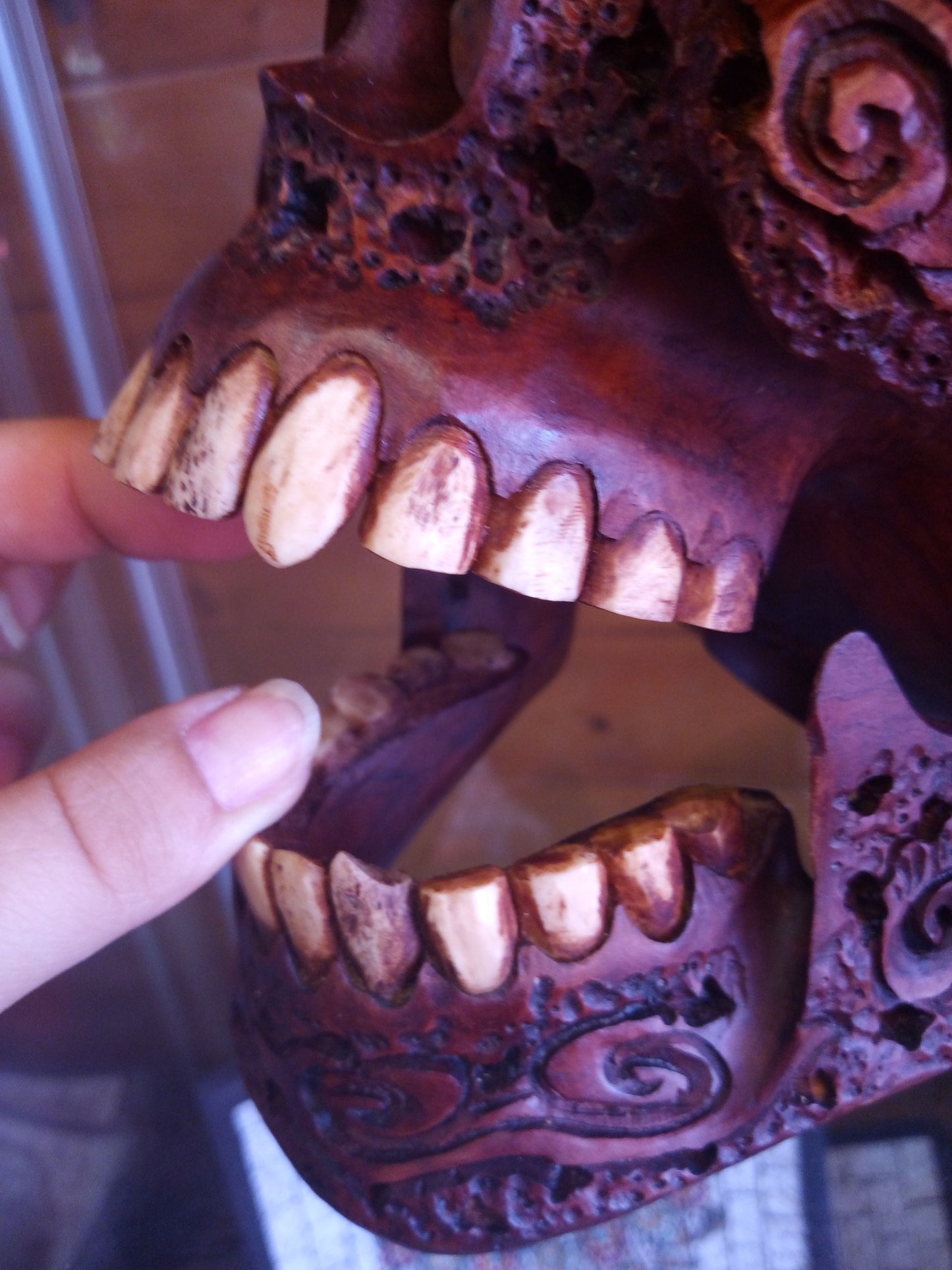 Human skull made of rosewood, carved and engraved