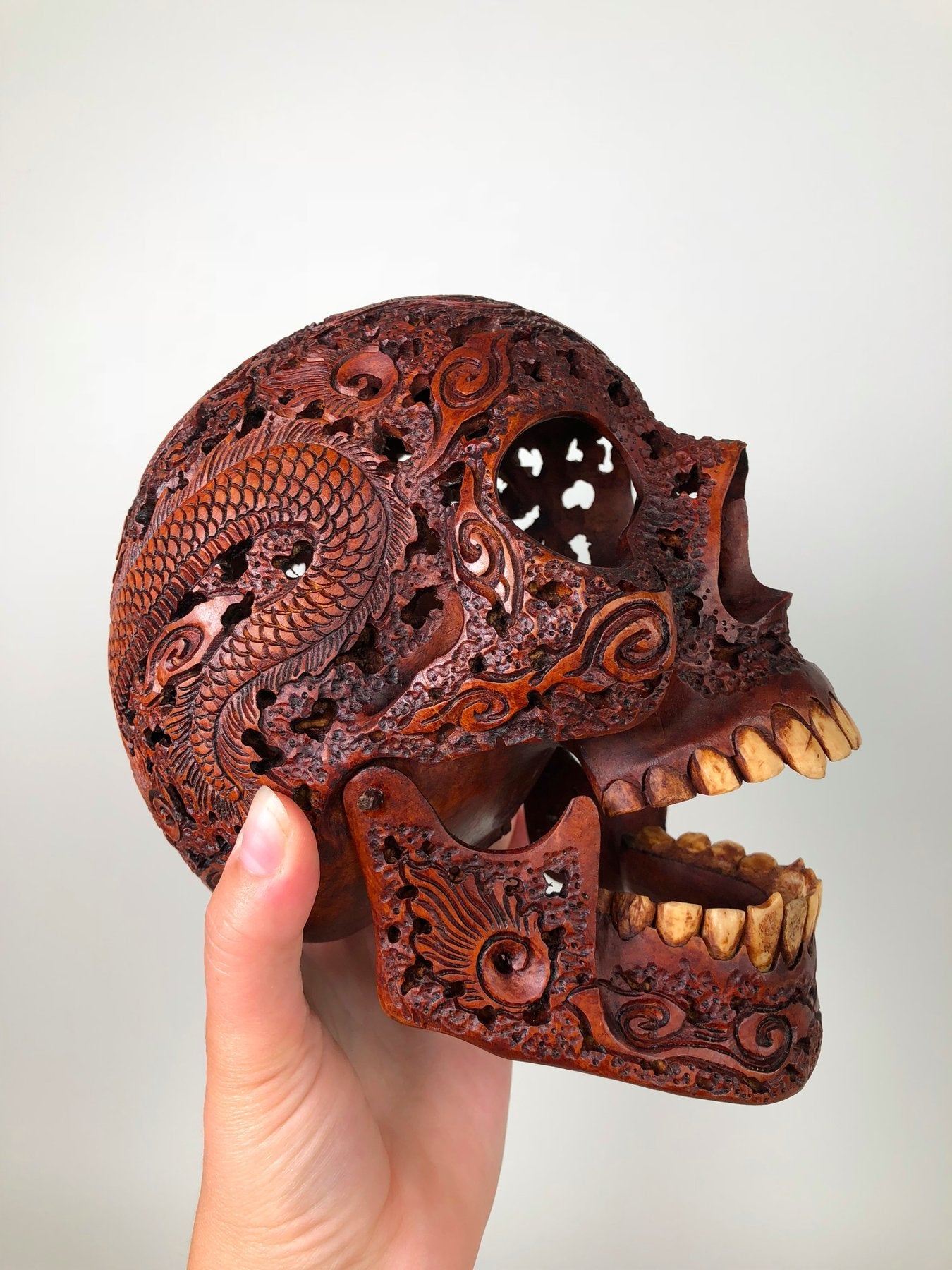 Human skull made of rosewood, carved and engraved