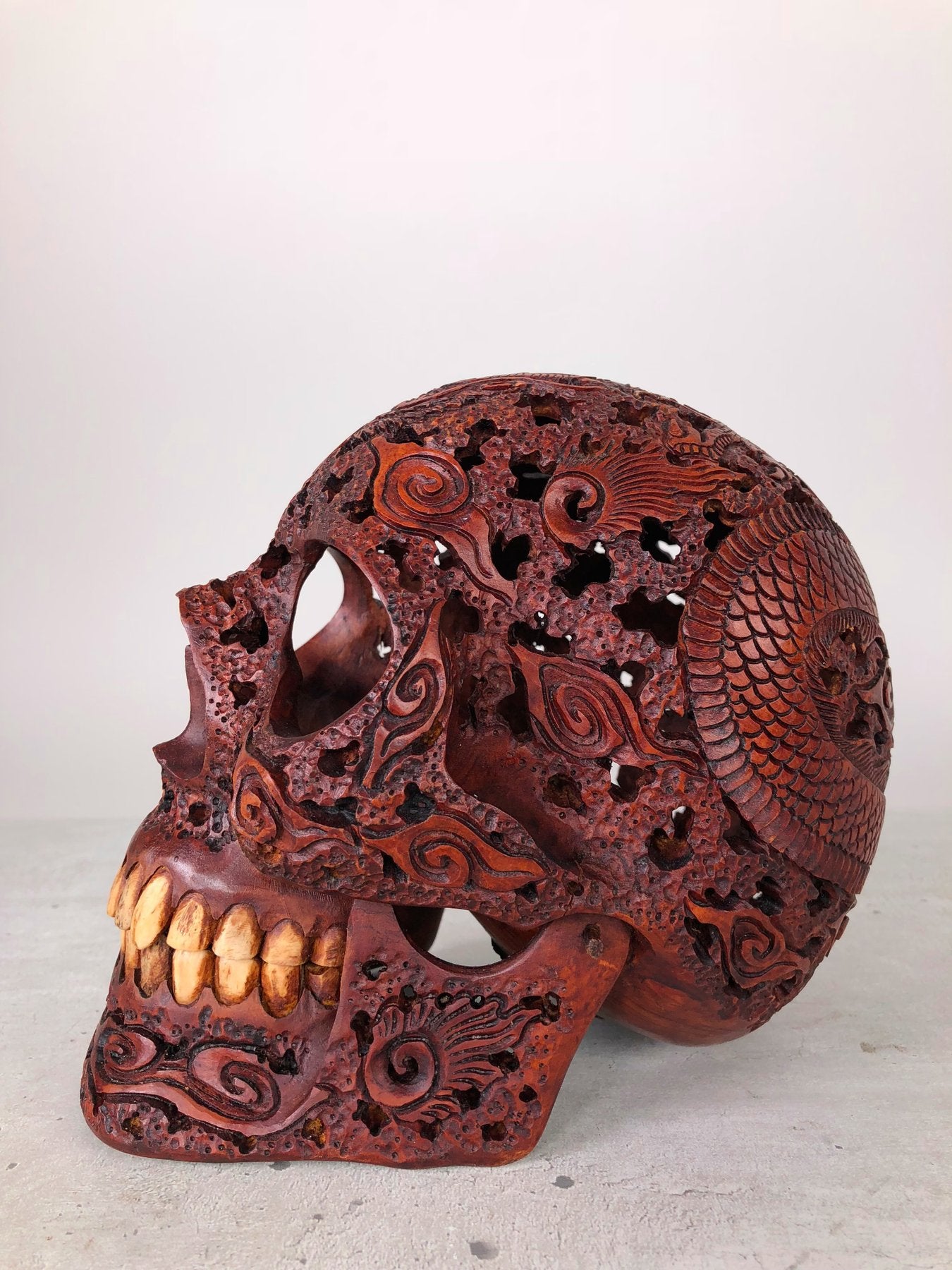 Human skull made of rosewood, carved and engraved
