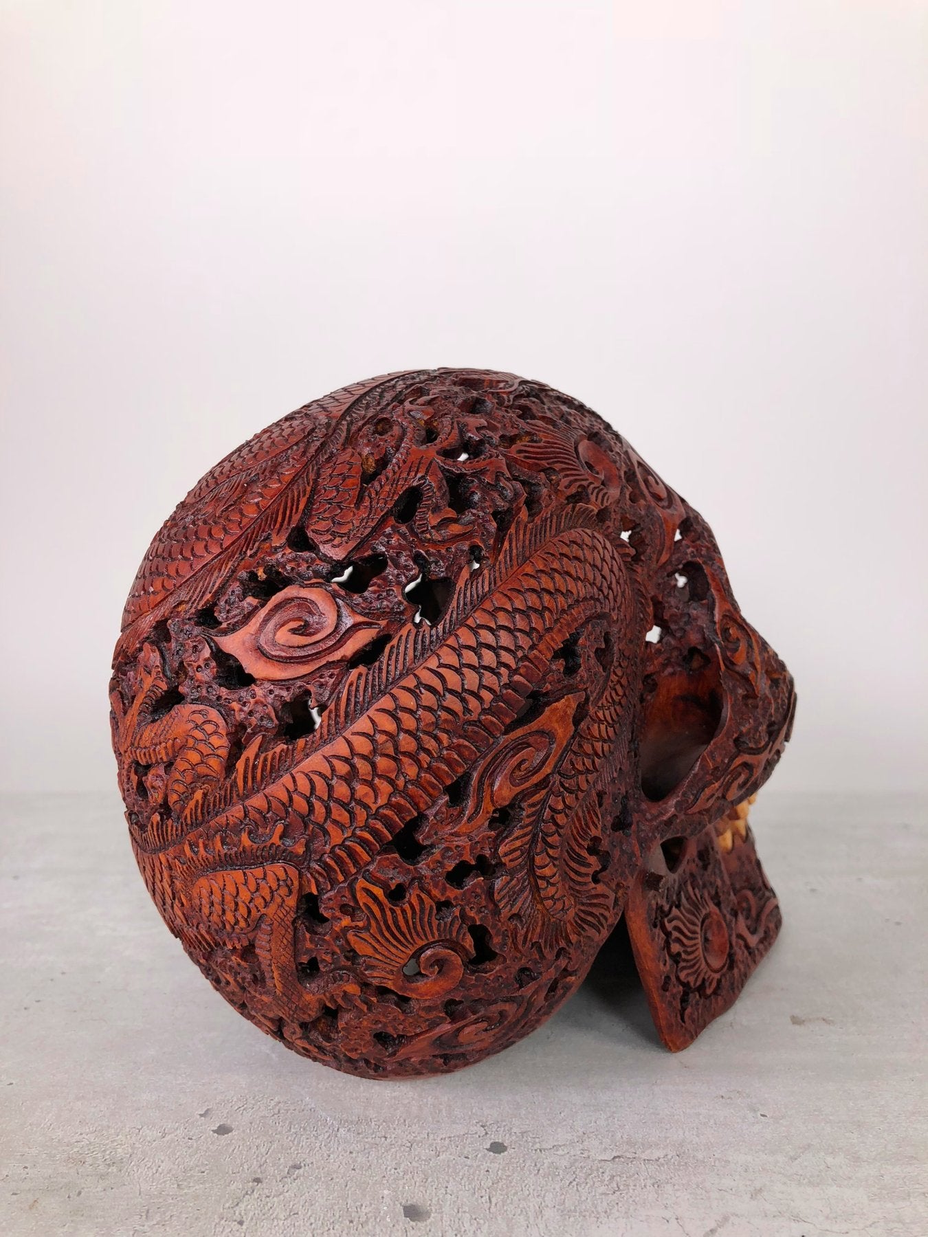 Human skull made of rosewood, carved and engraved