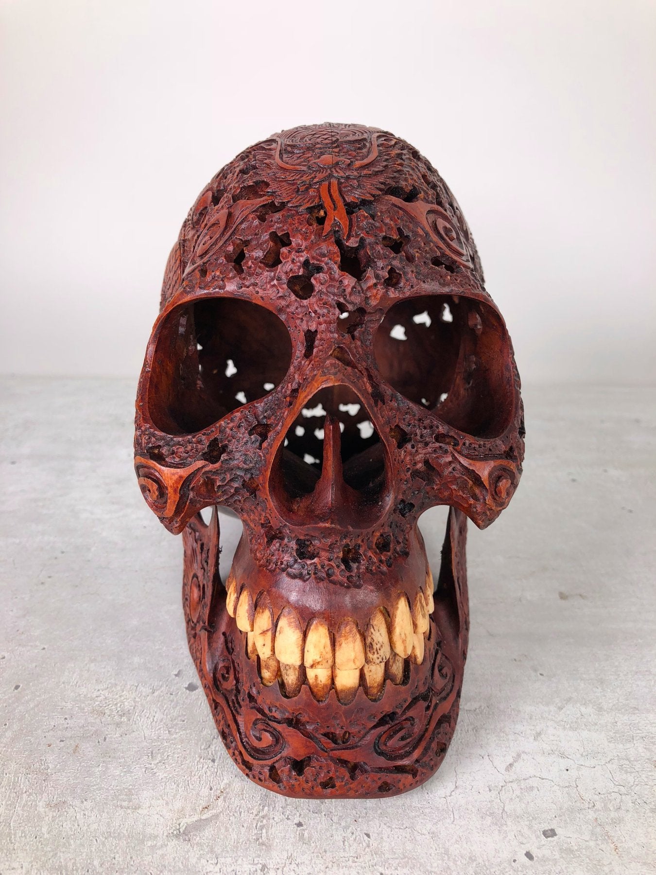 Human skull made of rosewood, carved and engraved