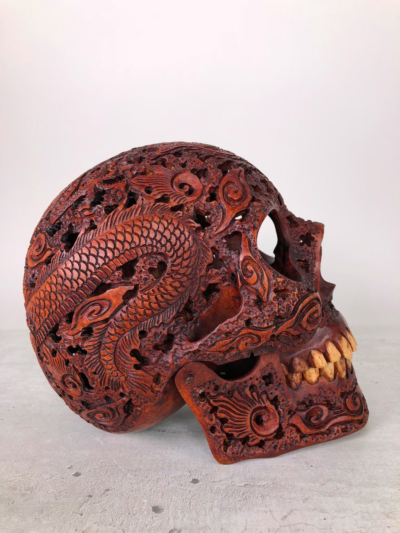 Human skull made of rosewood, carved and engraved