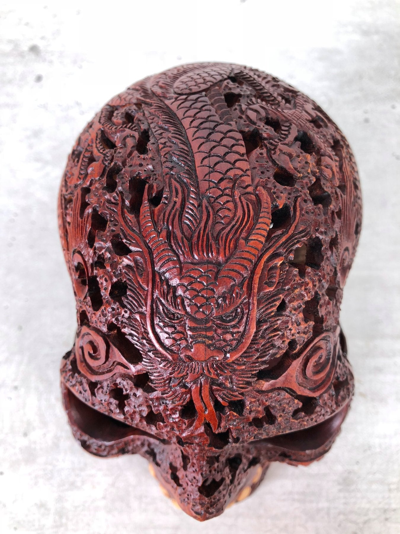 Human skull made of rosewood, carved and engraved