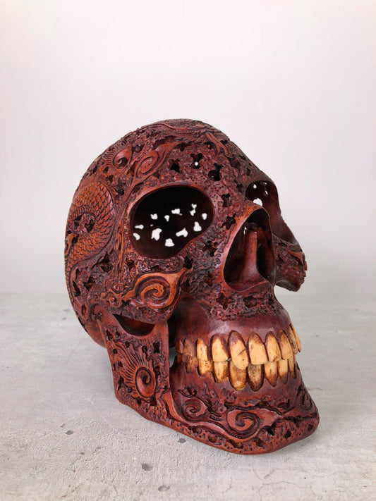 Human skull made of rosewood, carved and engraved 