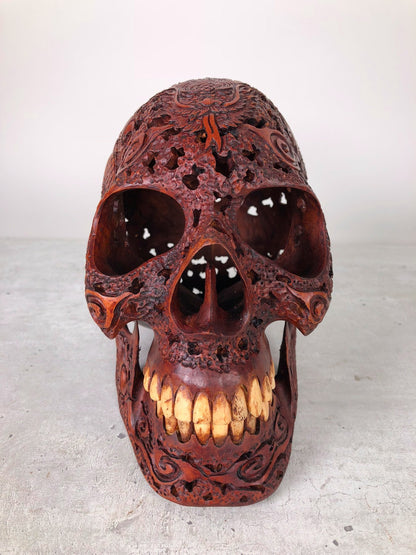 Human skull made of rosewood, carved and engraved 